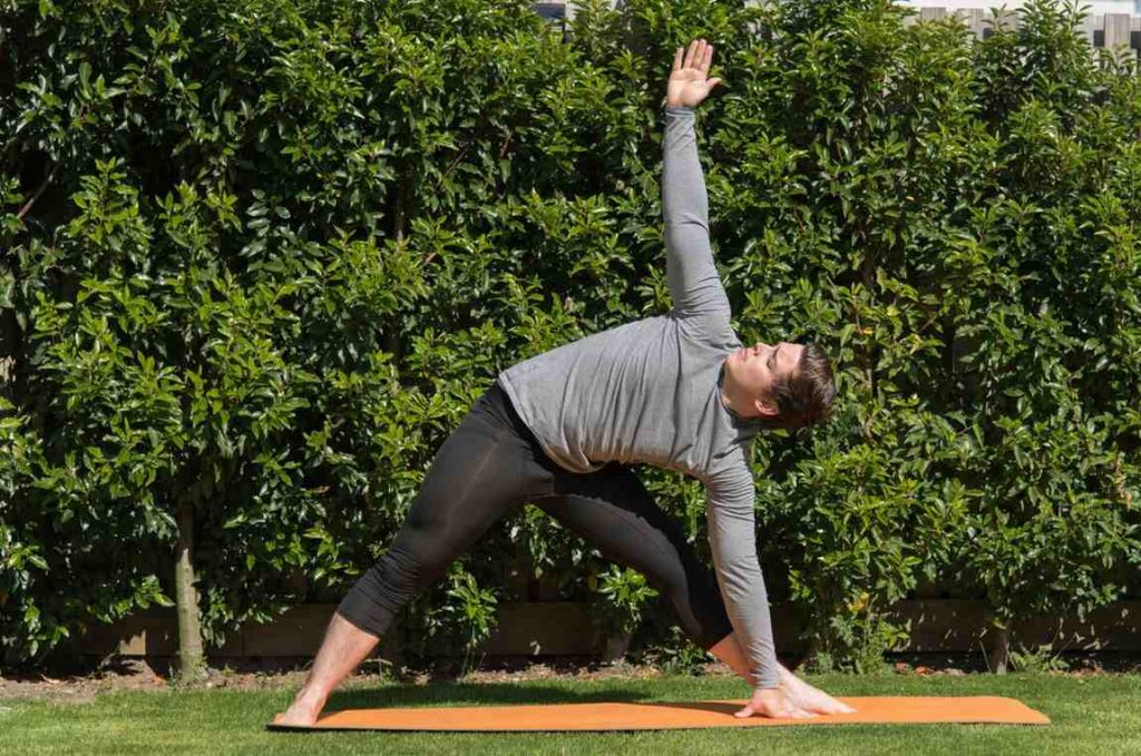 Man performing a thoracic mobility exercise